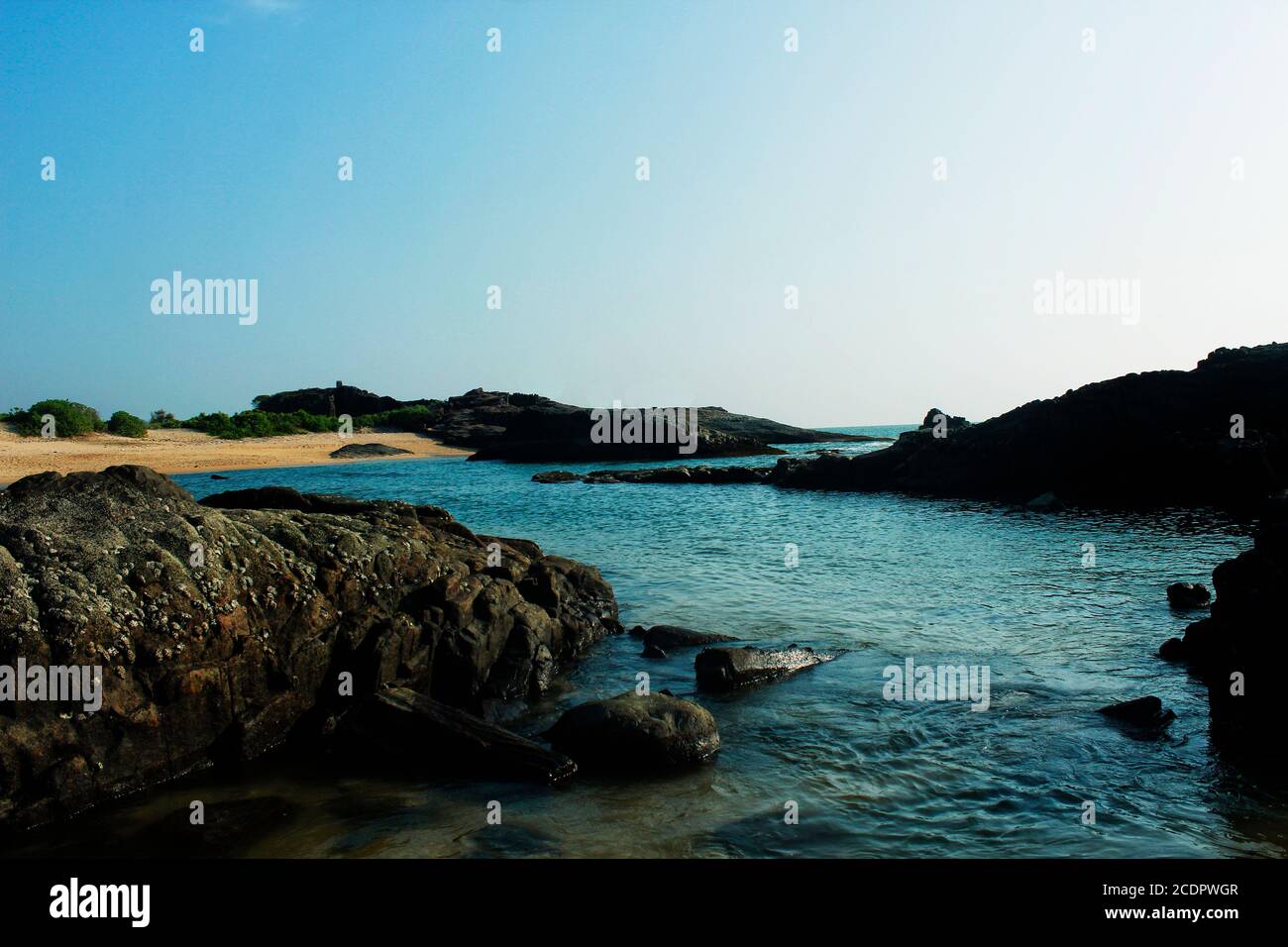 Rocky beaches with a shimmering ocean Stock Photo