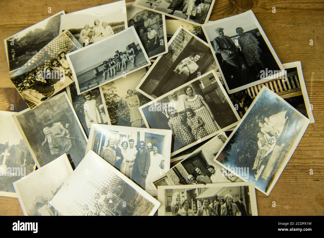 Old family sepia photos flay played on table from the 20s,30,s40s, showing ancestry family tree Stock Photo