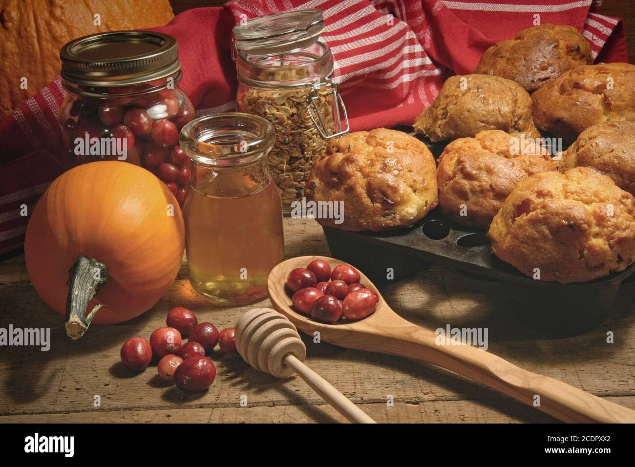 Muffins with fresh cranberries on table Stock Photo