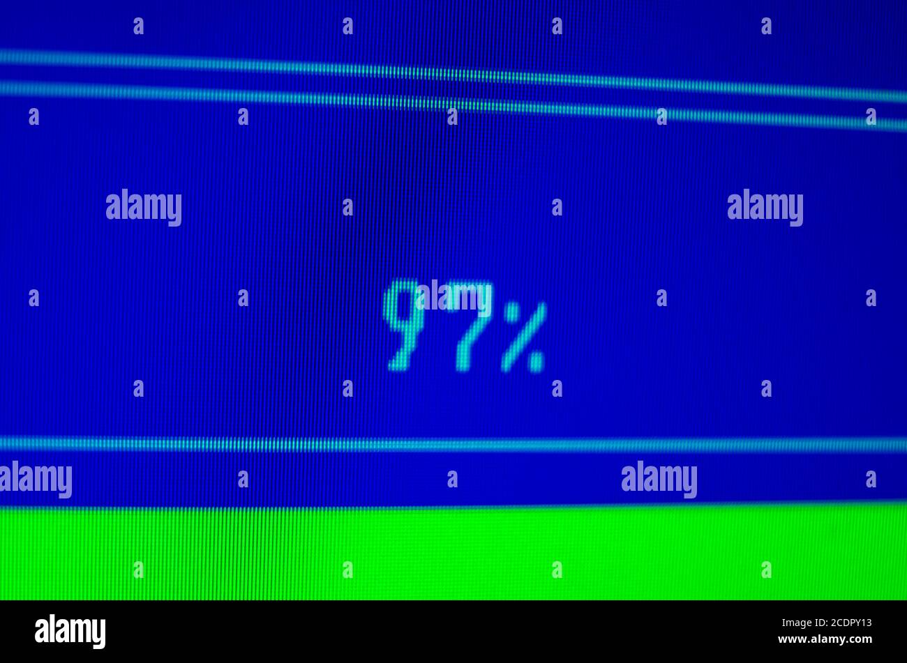 laptop with 97% loading bar on a blue screen. Setting the loading indicator concept Stock Photo