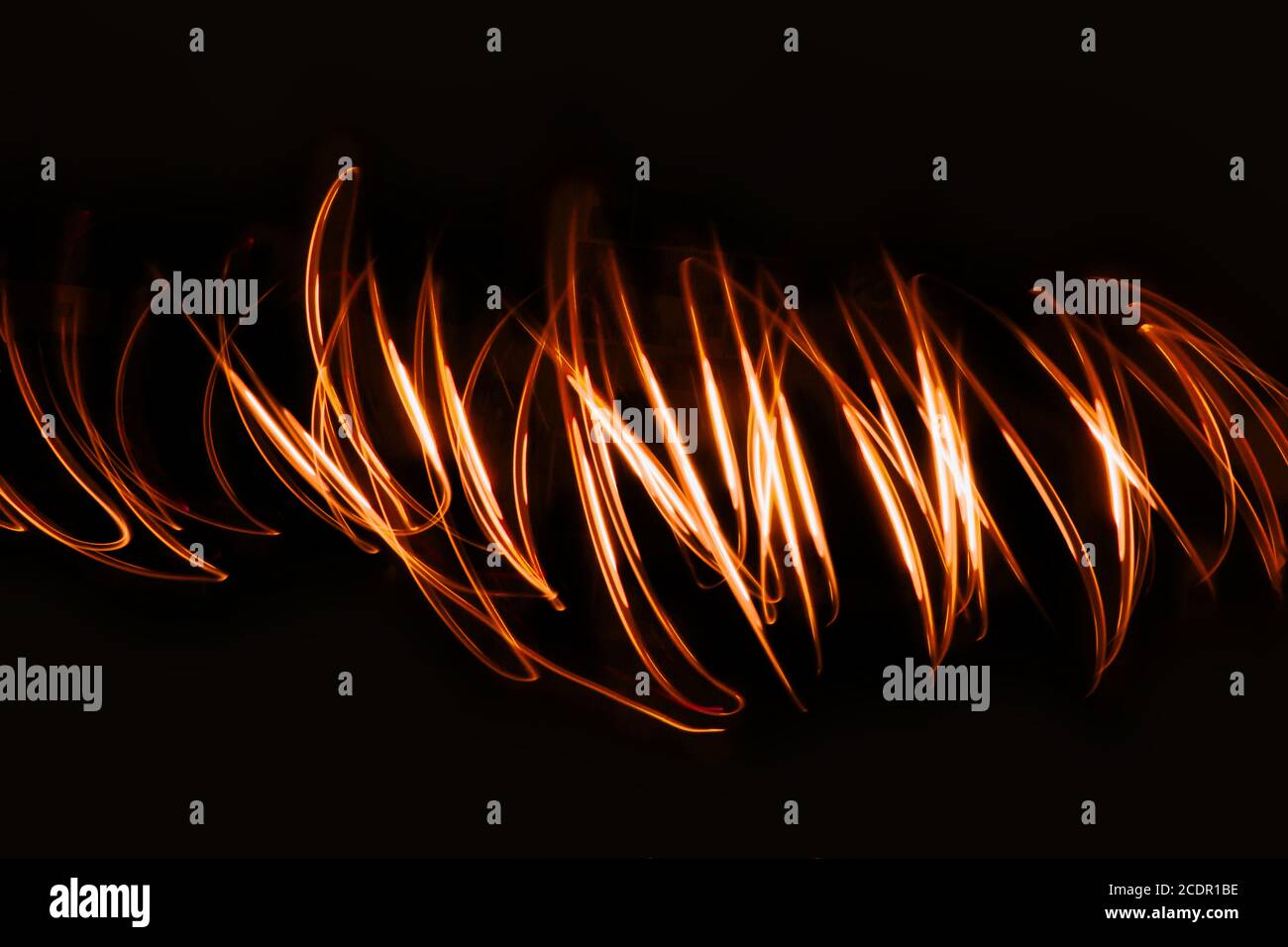Futuristic overlay light pattern.Abstract neon lights trails in the black background. Stock Photo