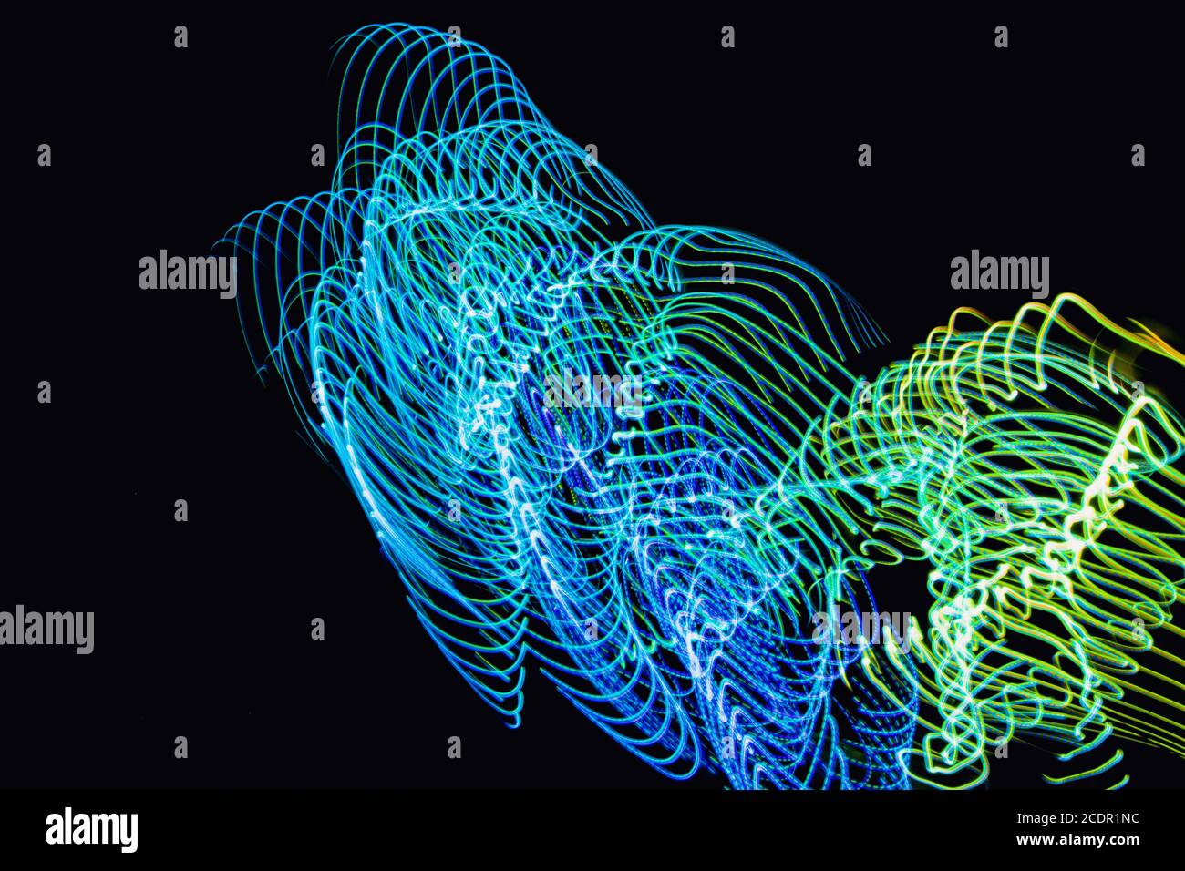 Futuristic overlay light pattern.Abstract neon lights trails in the black background. Stock Photo