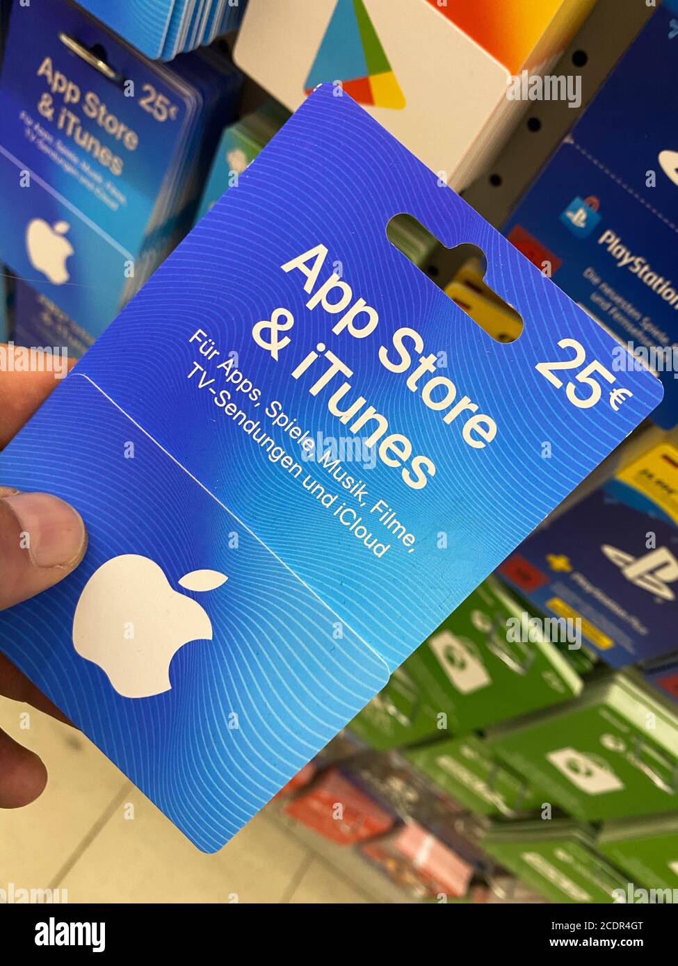 Viersen, Germany - July 9. 2020: View on apple itunes and app store gift  voucher card hold by hand in german supermarket Stock Photo - Alamy