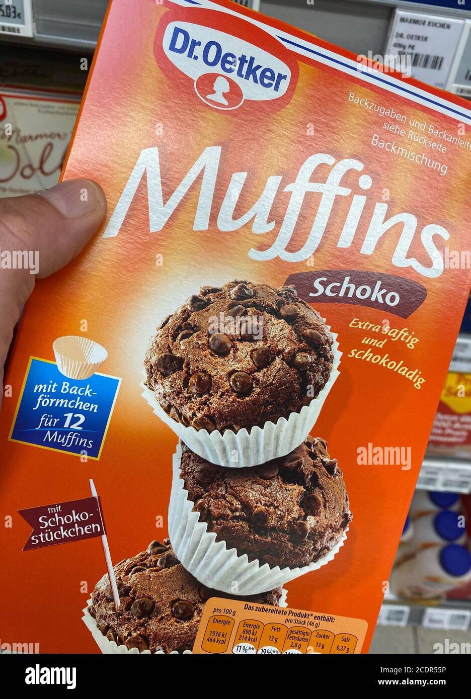 Viersen, Germany - July 9. 2020: Closeup of hand holding carton box dr. oetker  muffins ready baking mix in german supermarket Stock Photo - Alamy