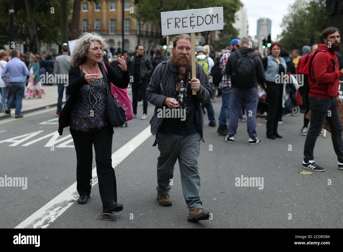 Anti-lockdown protesters, who believe that the coronavirus pandemic is a hoax, gather at the 'Unite For Freedom' rally in Trafalgar Square, London. Stock Photo