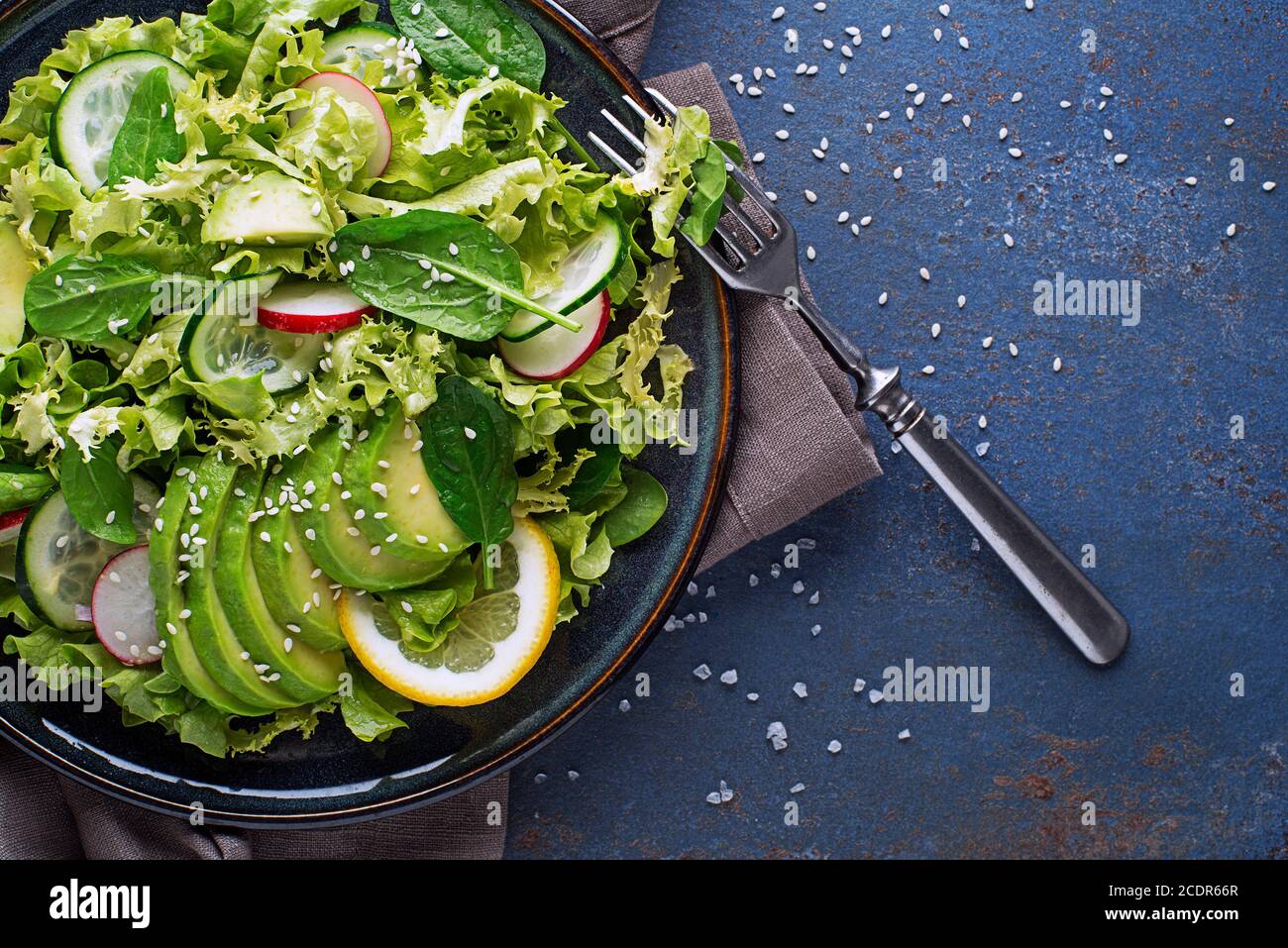 Healthy Green salad with avocado fresh light vegetables close up Stock Photo