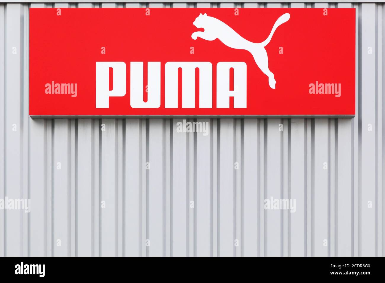 Bremen, Germany - July 2, 2017: Puma logo on a wall. Puma is a major german multinational company that produces athletic, casual footwear Stock Photo