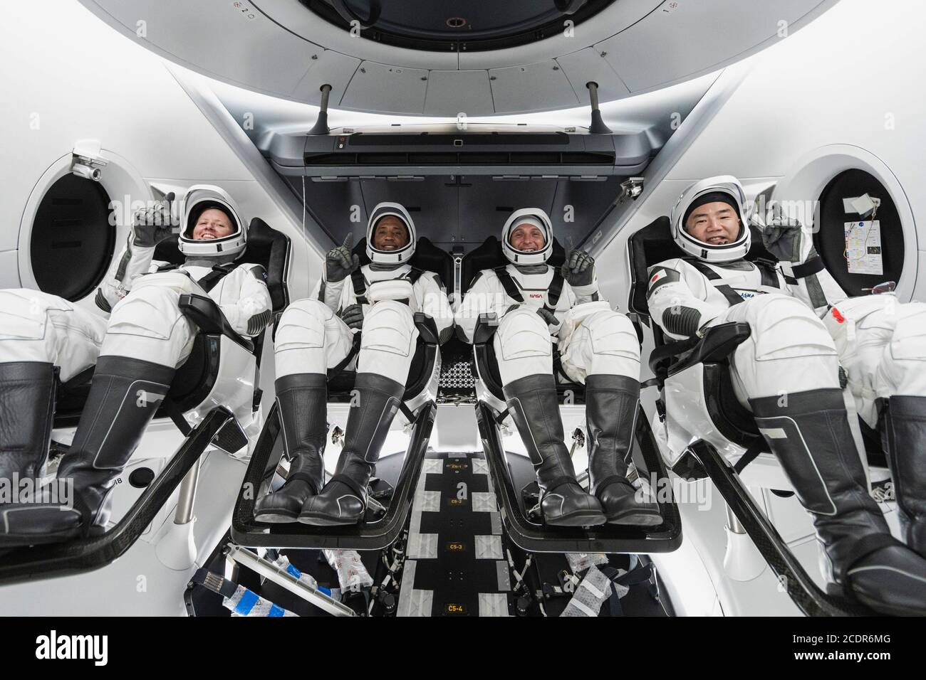 CAPE CANAVERAL, FL, USA - 14 August 2020 - From left, Mission Specialist Shannon Walker, Pilot Victor Glover, Crew Dragon Commander Michael Hopkins – Stock Photo