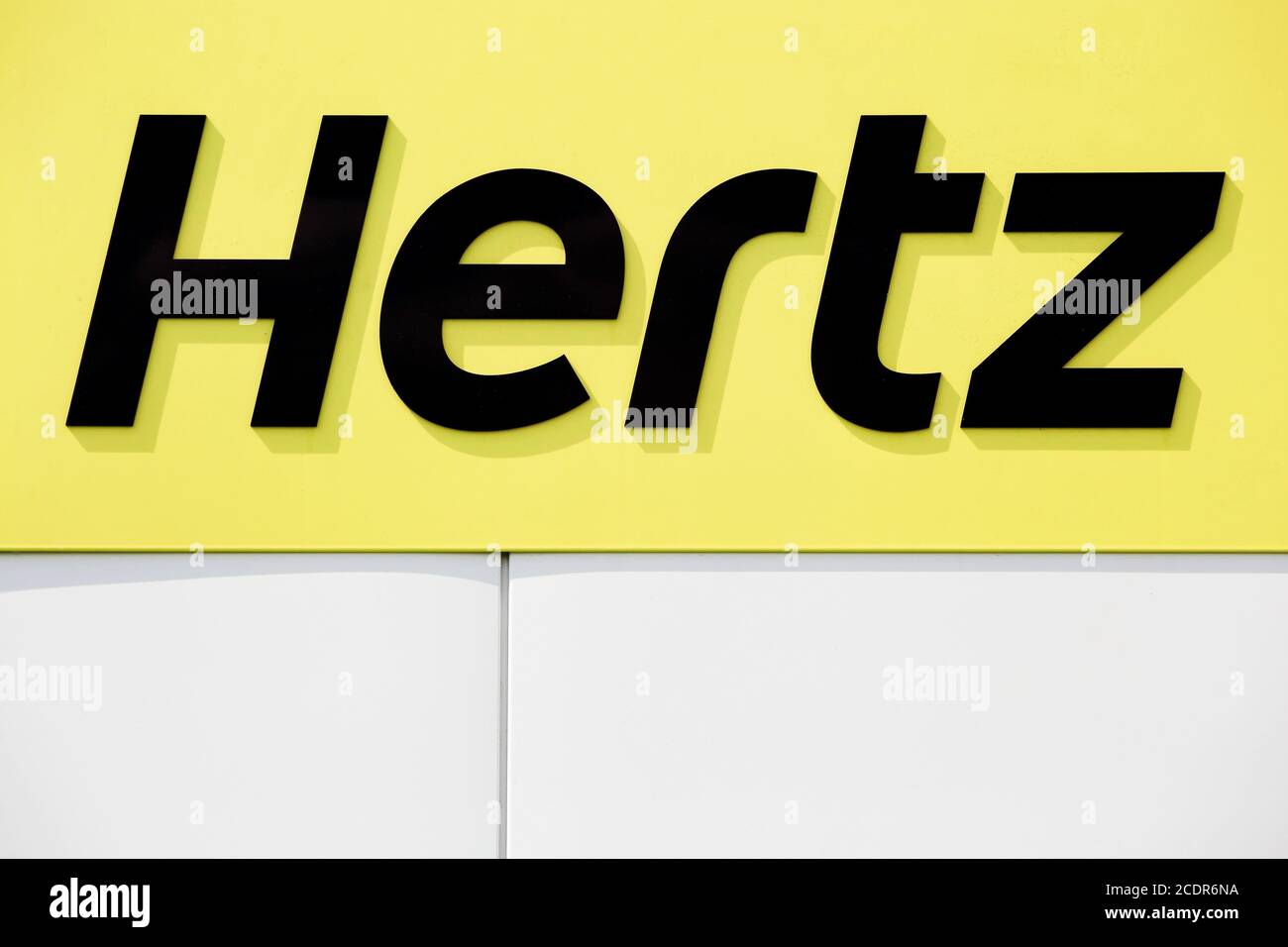 Villefranche sur Saone, France - May 24, 2015: Hertz logo on a wall. Hertz is an American car rental company Stock Photo