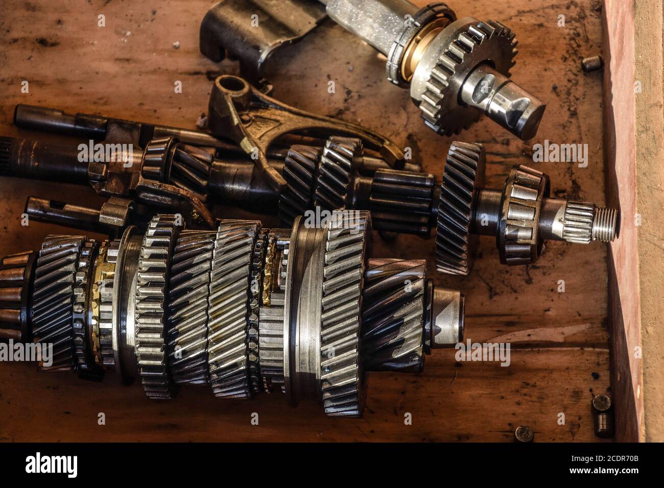Dismantled box car transmissions. The gears on the shaft of a mechanical transmission Stock Photo
