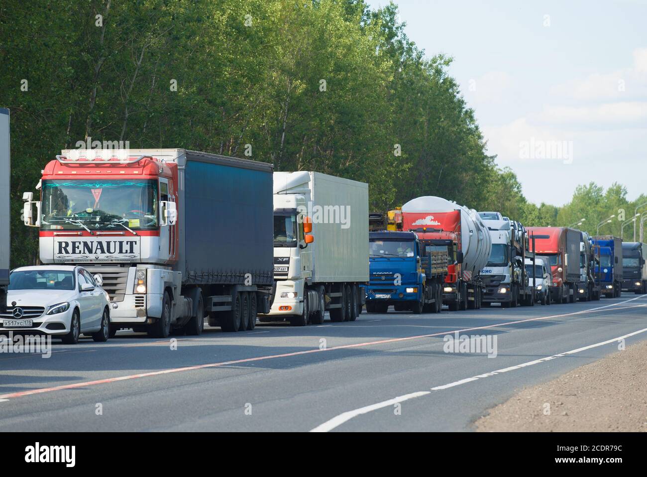 NOVGOROD REGION, RUSSIA - JUNE 27, 2018: A jam of trucks on the M10 'Russia' highway Stock Photo