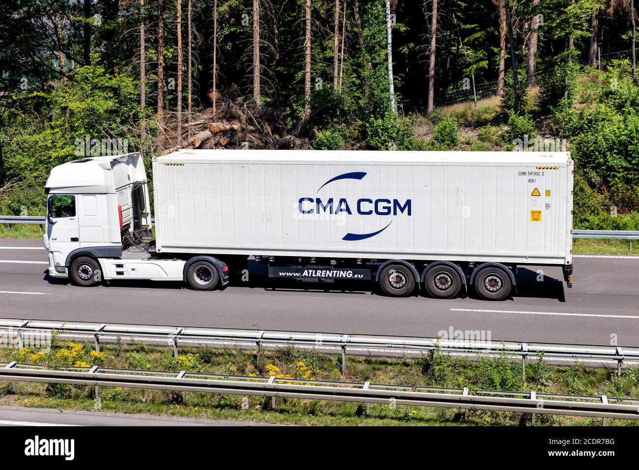 DAF XF truck with CMA CGM container on motorway. Stock Photo