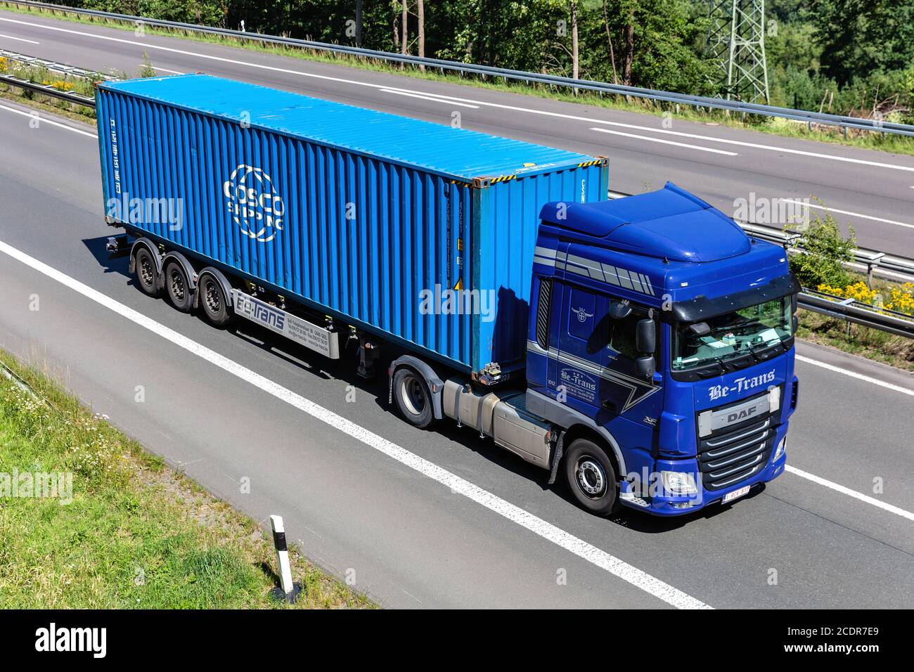 Be-Trans DAF XF truck with Cosco container on motorway. Stock Photo