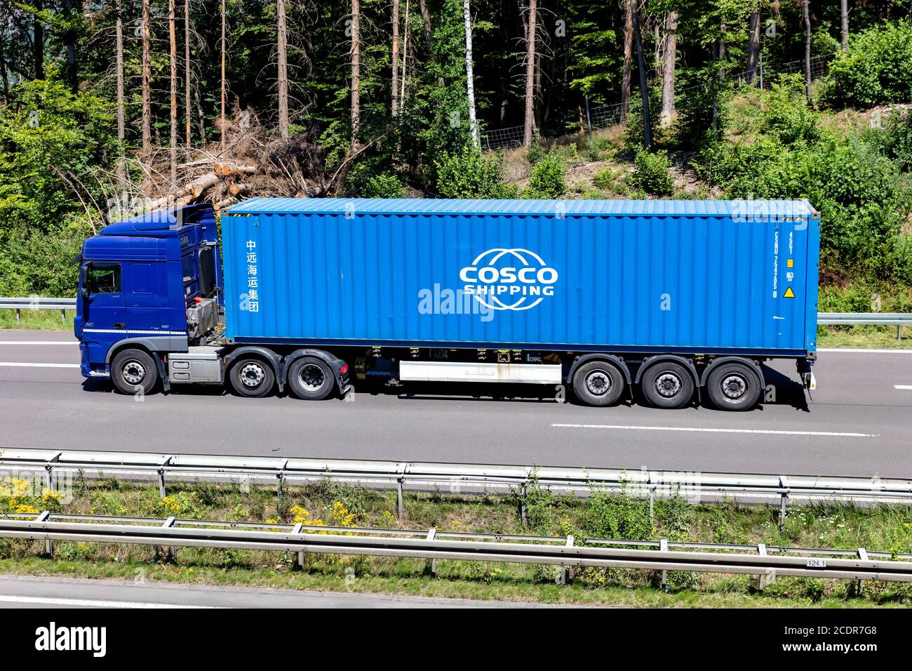 DAF XF truck with Cosco container on motorway. Stock Photo