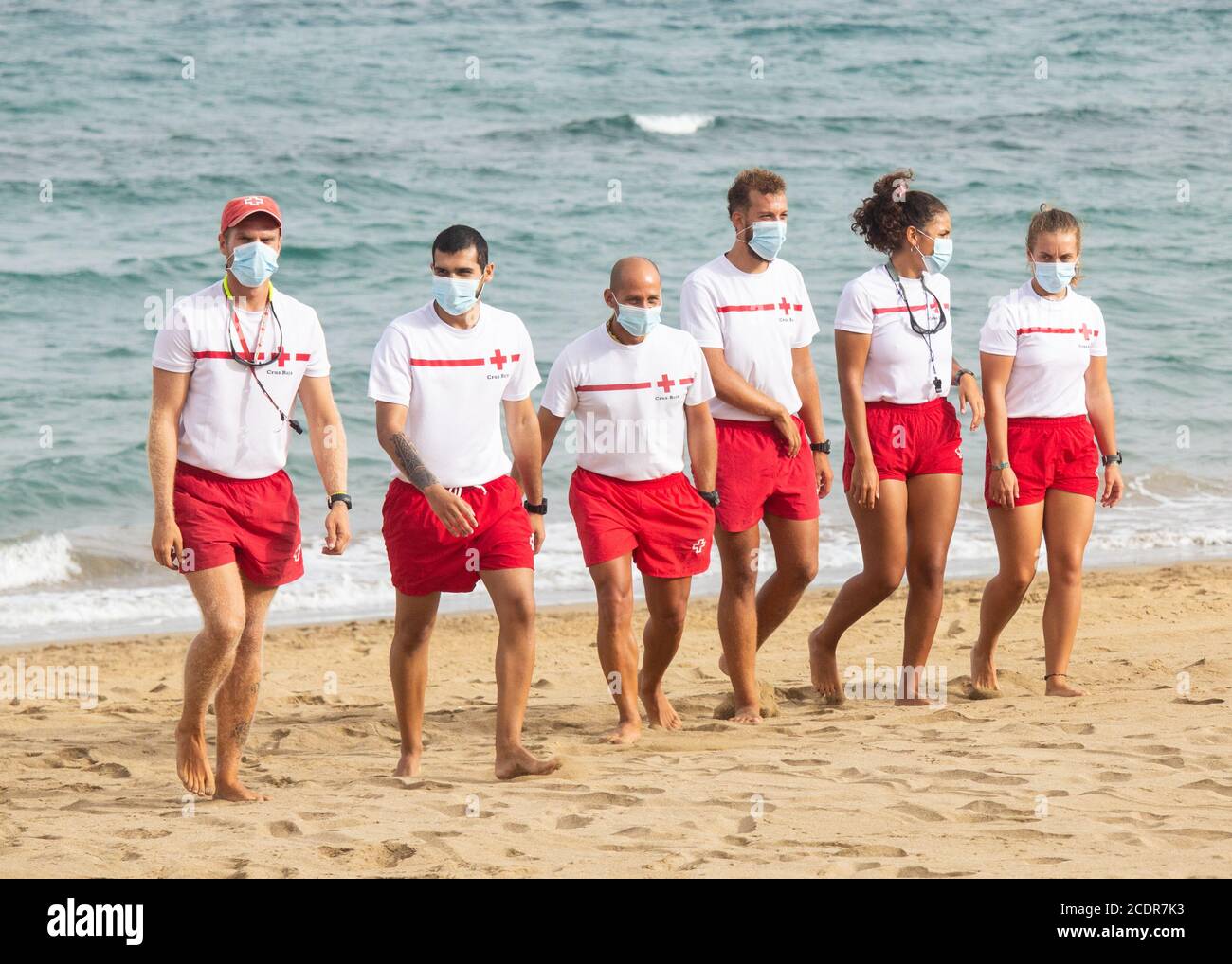Las Palmas, Gran Canaria, Canary Islands, Spain. 28th August, 2020. Lifeguards wearing face masks on the city beach in Las Palmas on Gran Canaria. The Canary Islands have seen a huge spike in Coronavirus infections in August, with Las Palmas registering the most cases. Credit: Alan Dawson/Alamy Live News Stock Photo