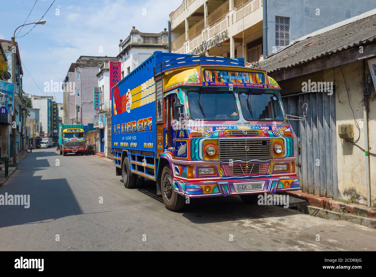 COLOMBO, SRI LANKA - FEBRUARY 23, 2020: Two multi-colored Lanka Ashok Leyland trucks on a city street Stock Photo