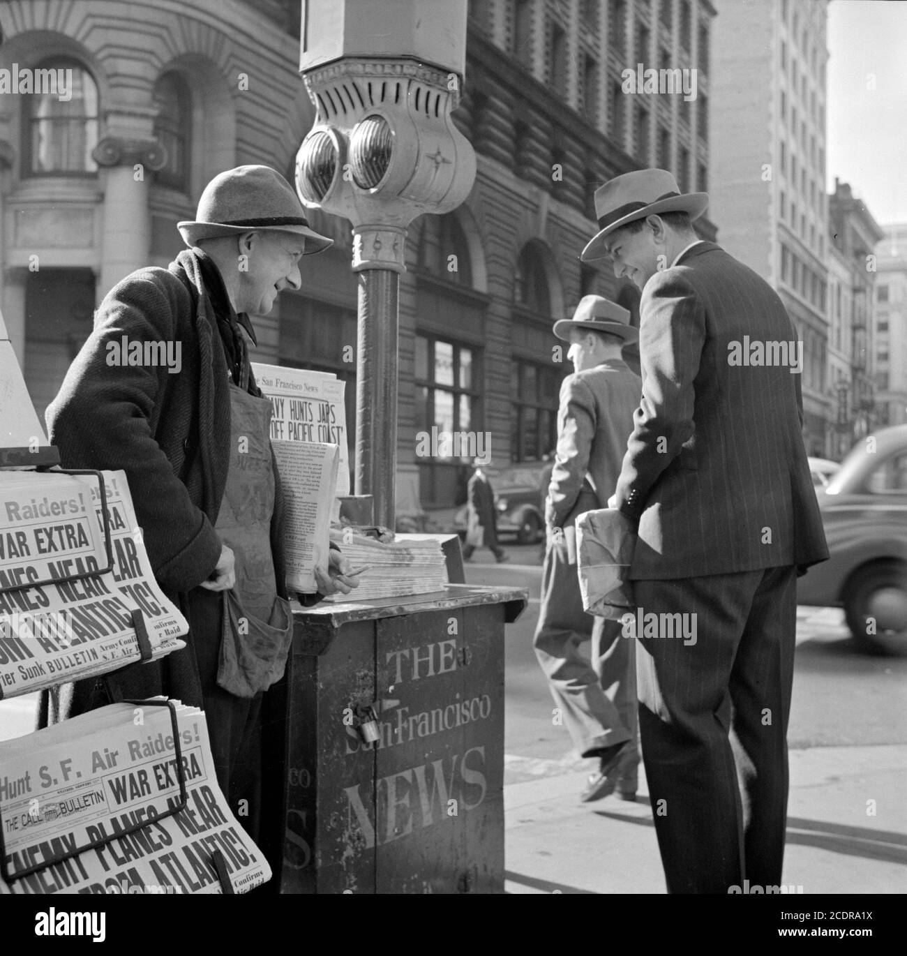 Pearl Harbor 1941. Newspaper vendor in San Francisco on December 8, 1941, the day after the Japanes attack on Pearl Harbor. Photo by John Collier Jr. Stock Photo