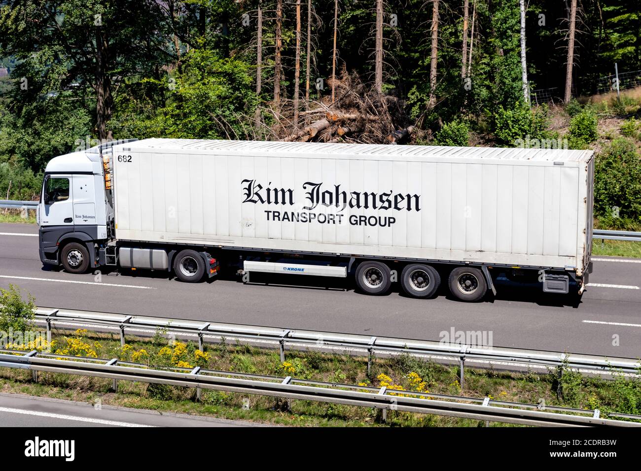 Kim Johansen Mercedes-Benz Actros truck with box trailer on motorway. Stock Photo