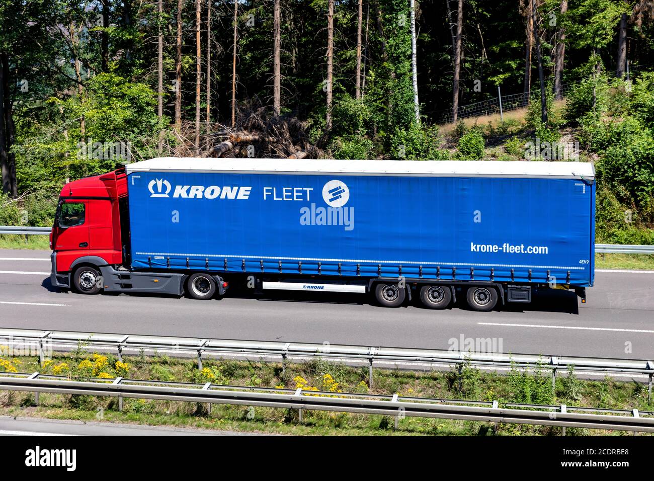 Mercedes-Benz Actros truck with Krone Fleet curtainside trailer on motorway. Stock Photo