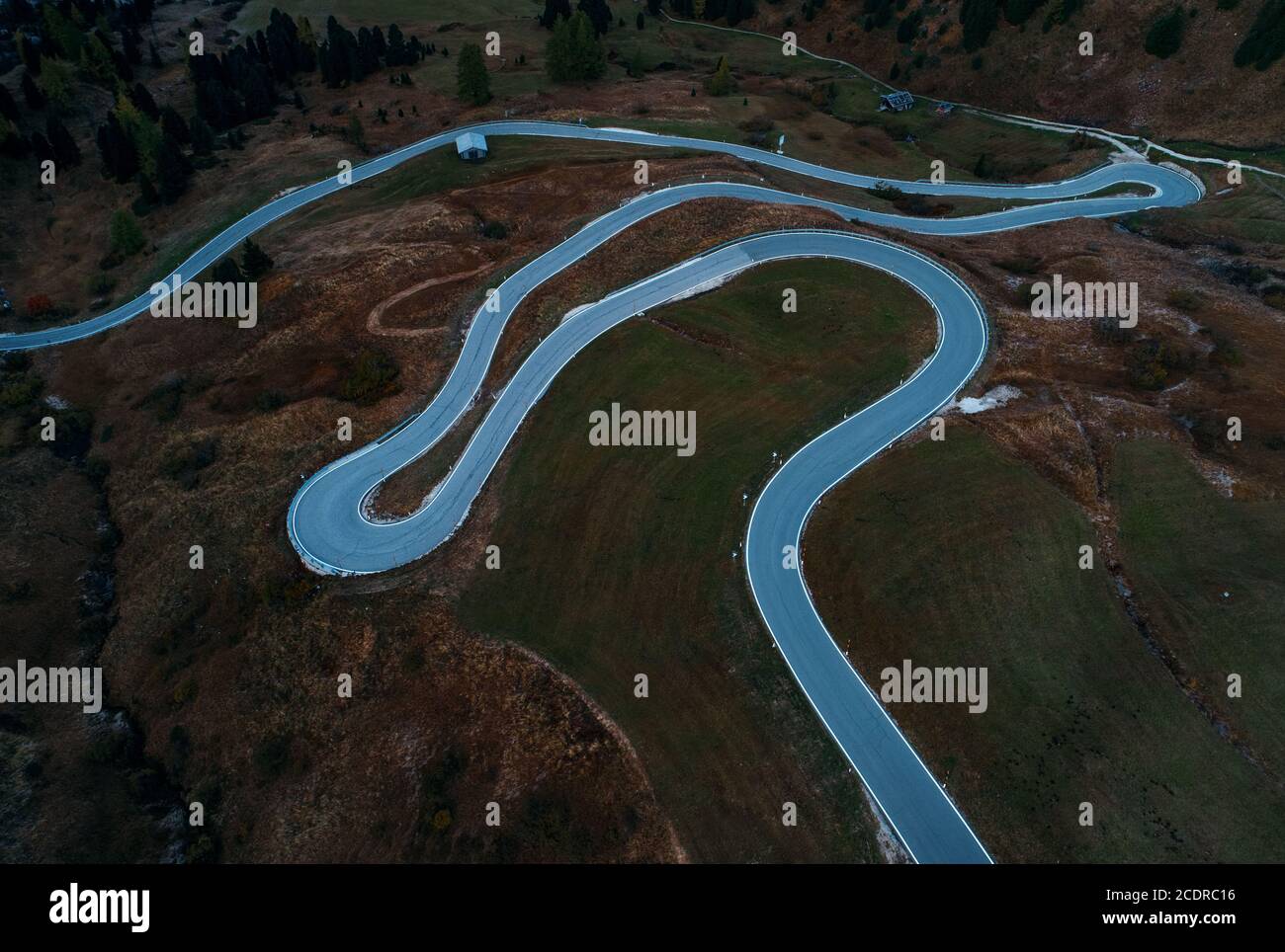 Dolomites winding road aerial view in North Italy Stock Photo - Alamy