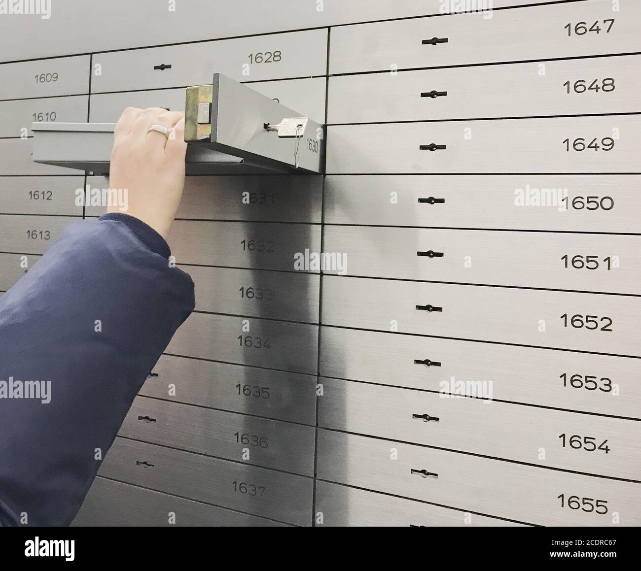 Safe deposit box open in a sure safe deposit cell Stock Photo