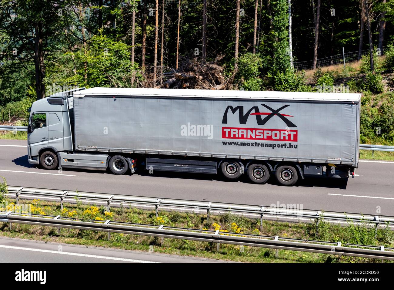 Max Transport Volvo FH truck with curtainside trailer on motorway. Stock Photo