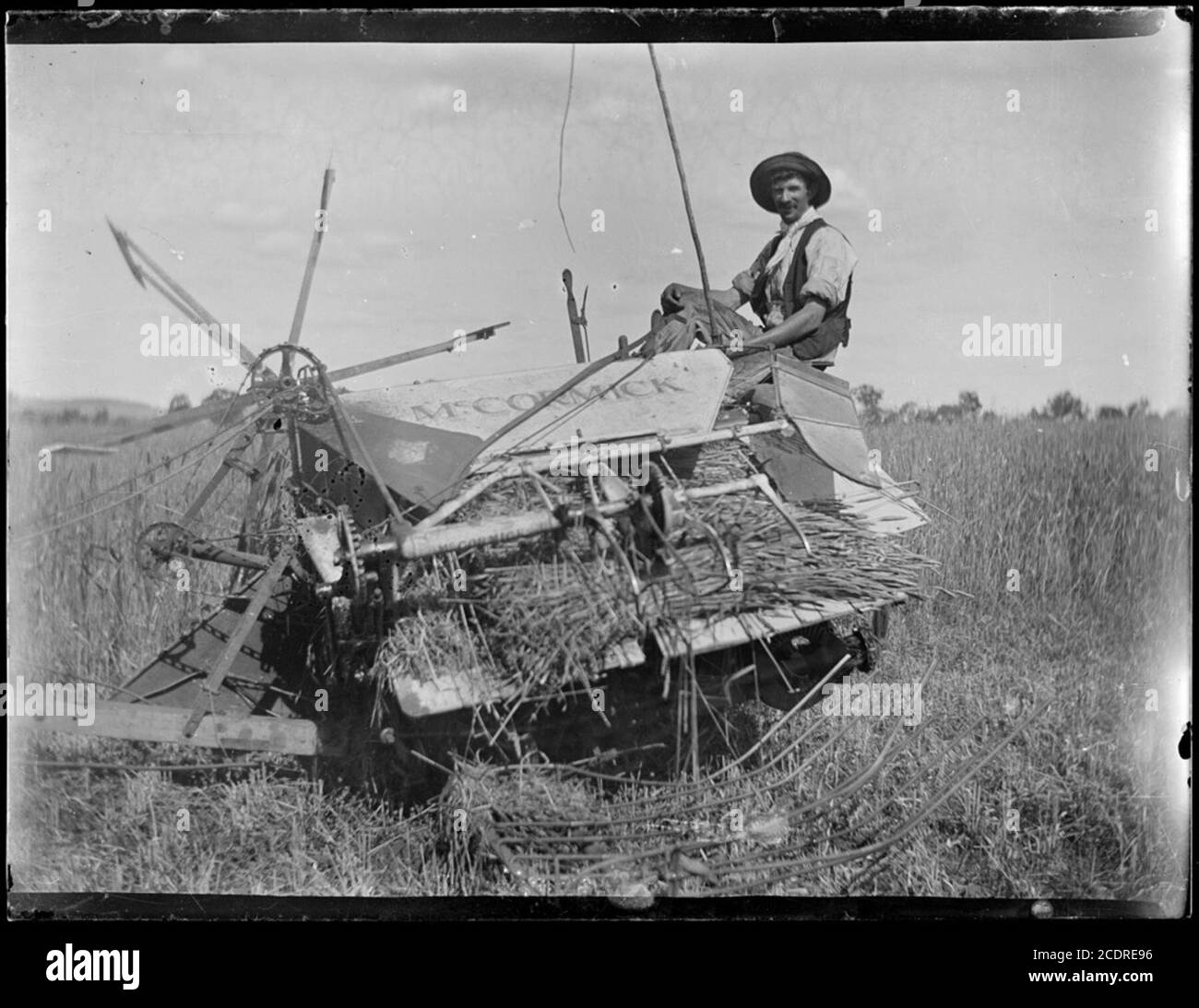 A. Baylon sitting on harvester, Wagga Wagga Region, New South Wales, ca