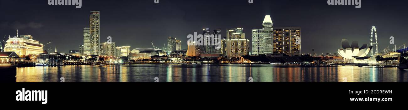 Singapore skyline at night with urban buildings Stock Photo