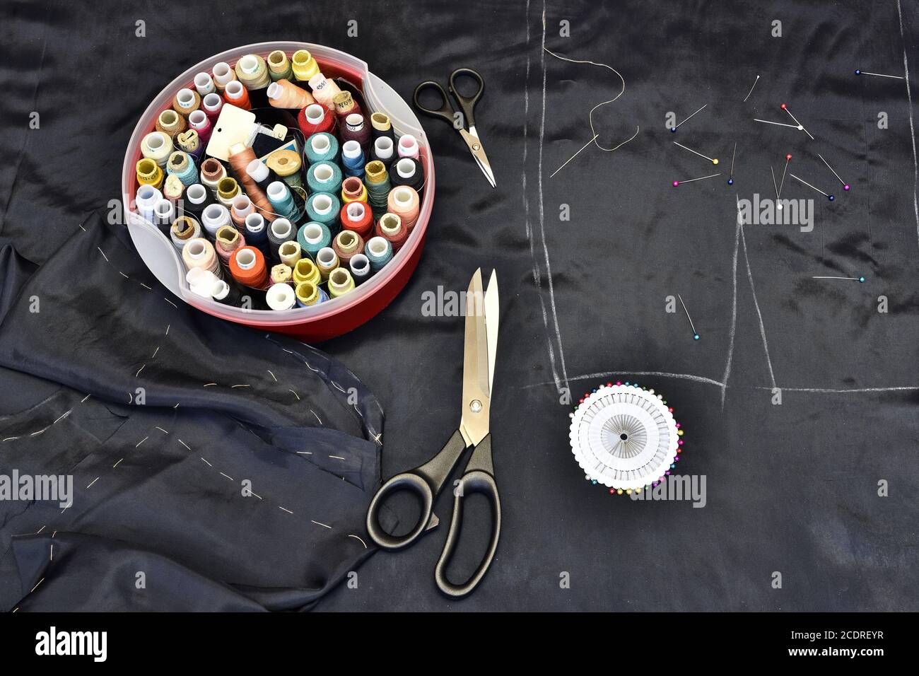 Creating clothing pattern, scissors, fabric, thread and pins Stock