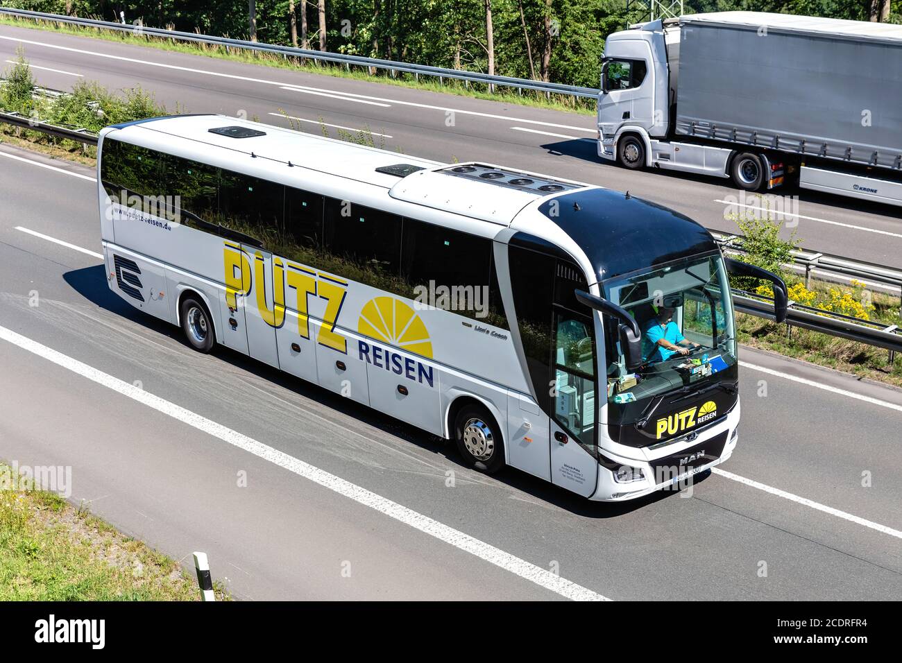 Pütz Reisen MAN Lion’s Coach on motorway. Stock Photo