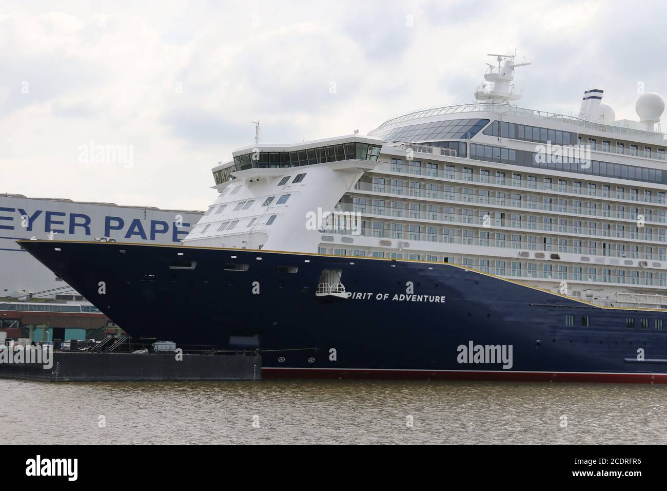 The cruise ship Spirit of Adventure lies in front of the Meyer Shipyard in Papenburg on August 1st, 2020. Stock Photo