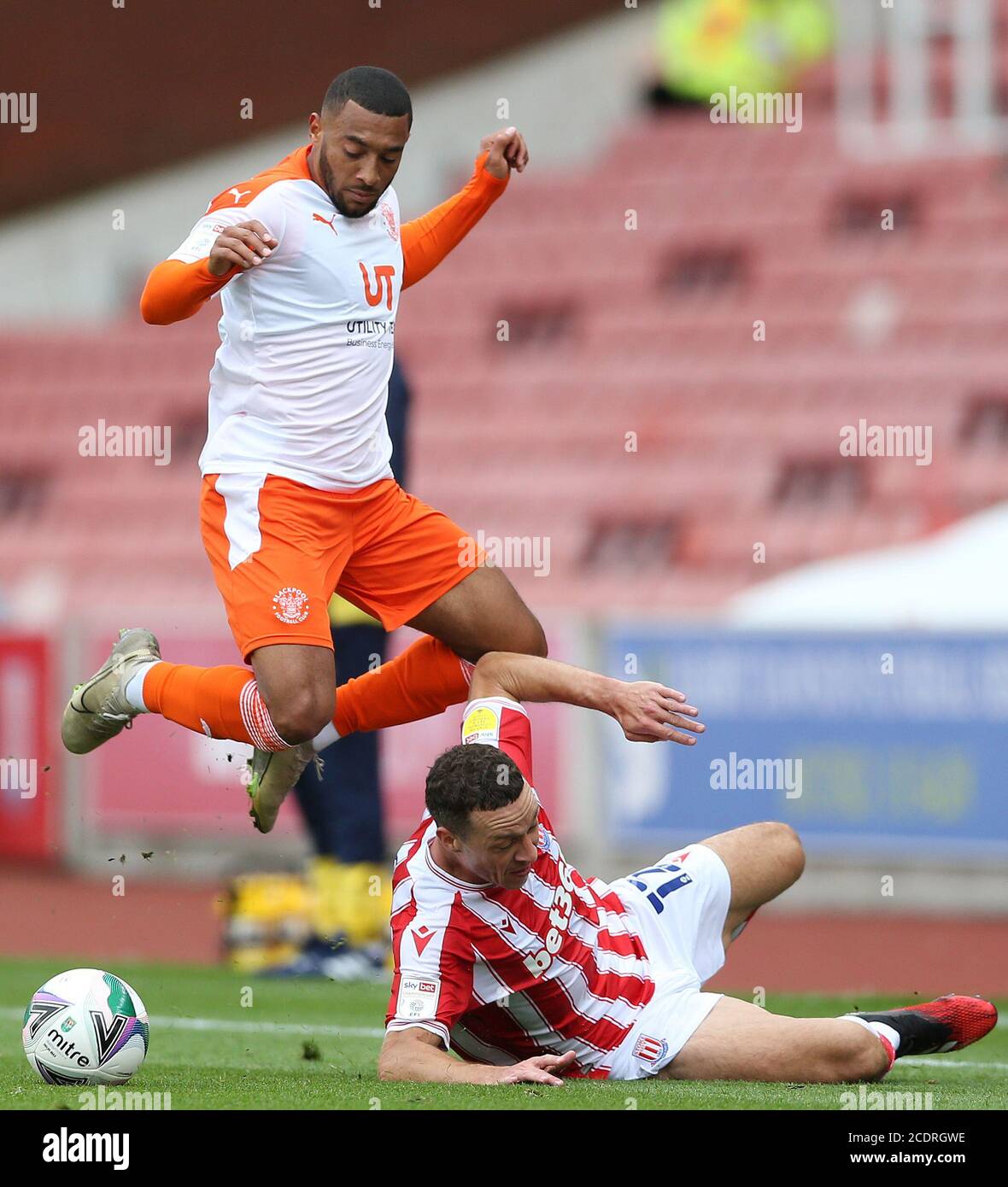 Stoke City's Jordan James Chester and Blackpool's Keshi Anderson during the Carabao Cup match at the bet365 Stadium, Stoke. Stock Photo