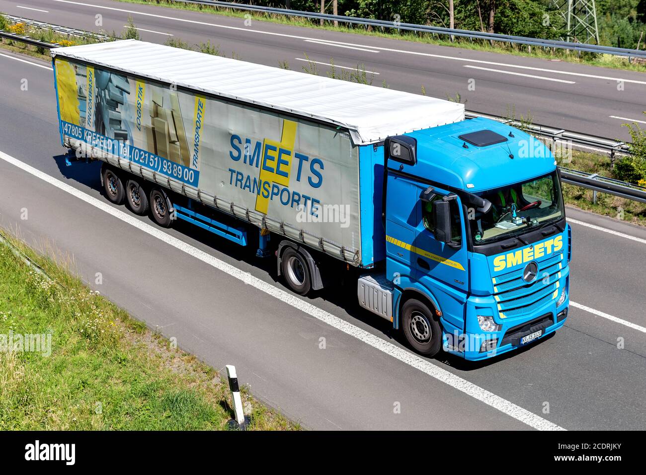 Smeets Mercedes-Benz Actros truck with curtainside trailer on motorway. Stock Photo