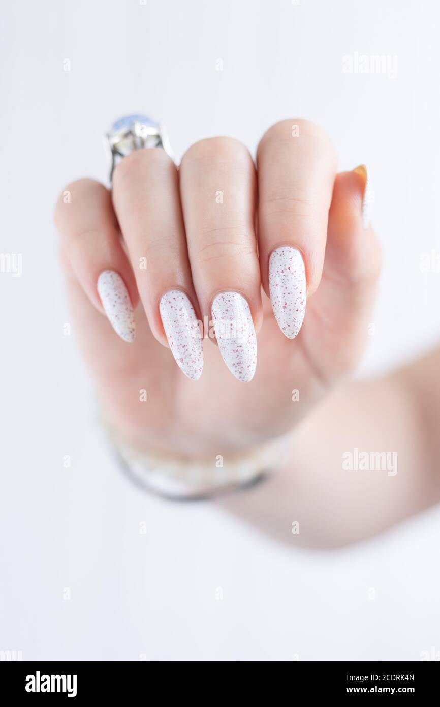 Female hand with long nails and a bottle of light white nail polish Stock Photo - Alamy Female hand with long nails and a bottle of light white nail polish Stock Photo - Alamy