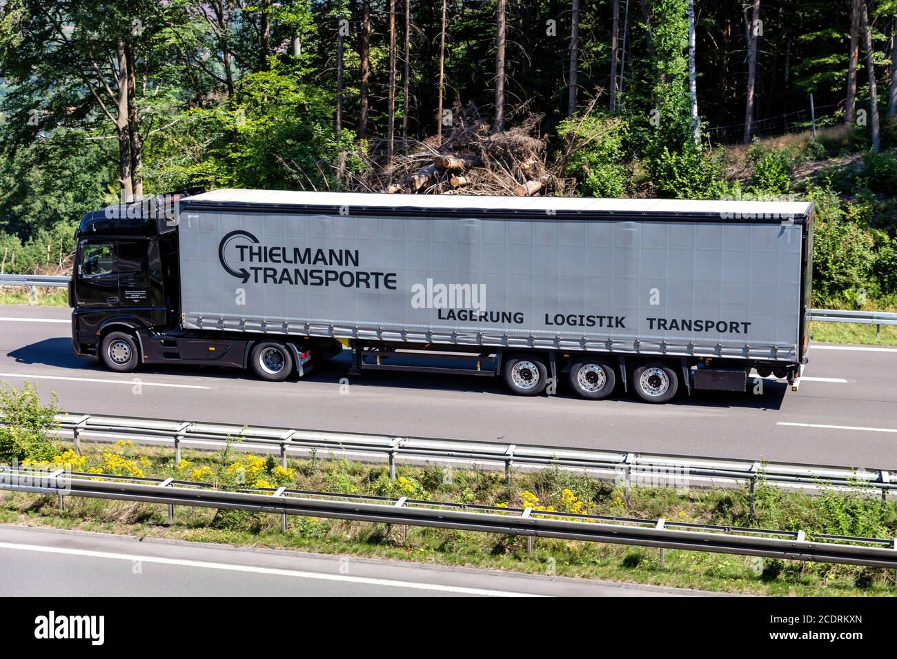 Thielmann Mercedes-Benz Actros truck with curtainside trailer on motorway. Stock Photo