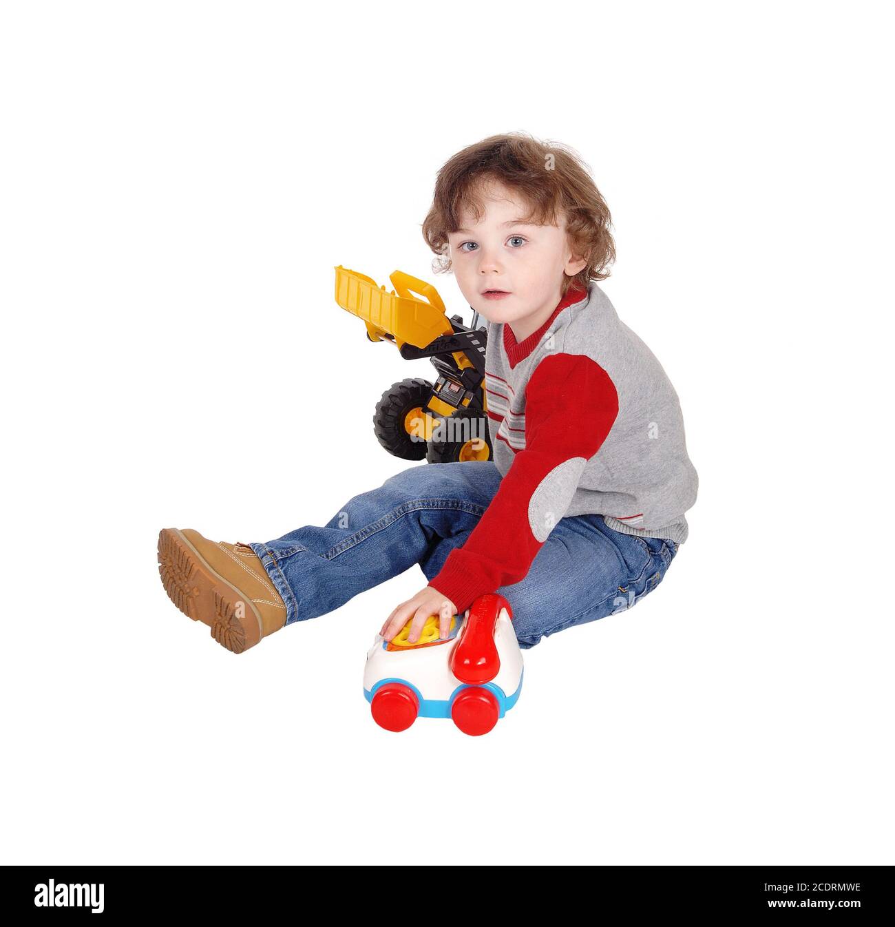 Little boy playing with his toys. Stock Photo