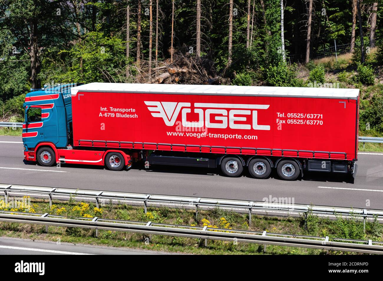 Vögel Scania truck with curtainside trailer on motorway. Stock Photo