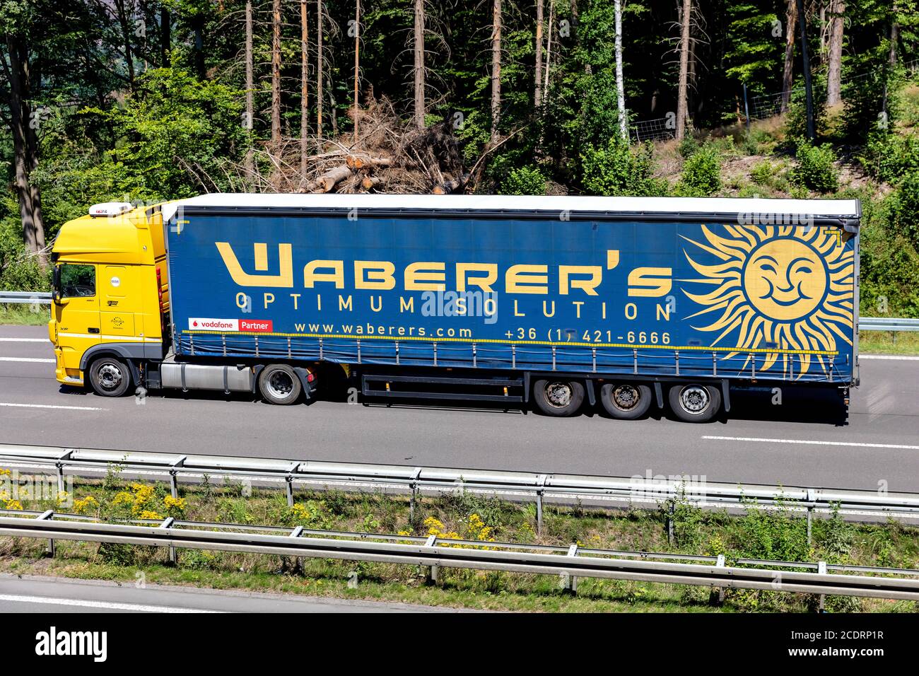 Waberer’s DAF XF truck with curtainside trailer on motorway. Stock Photo