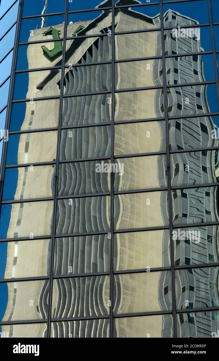 Downtown buildings are reflected in the windows of a skyscrapper in Nashville, Tennessee USA. Stock Photo