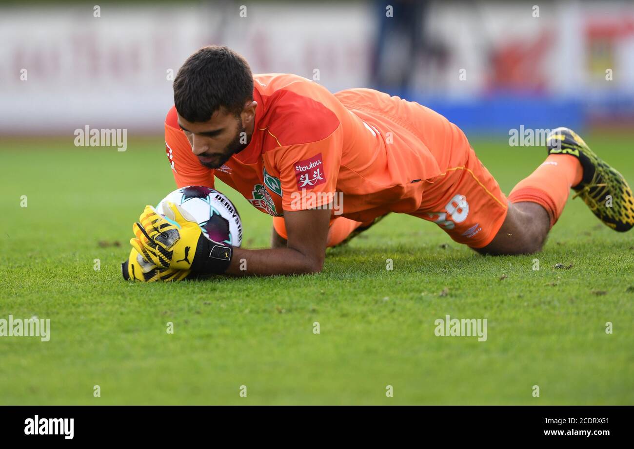 Lohne, Germany. 29th Aug, 2020. Football: Test matches: SV Werder Bremen - FC St.Pauli. Werder goalkeeper Eduardo dos Santos Haesler has the ball. Credit: Carmen Jaspersen/dpa - IMPORTANT NOTE: In accordance with the regulations of the DFL Deutsche Fußball Liga and the DFB Deutscher Fußball-Bund, it is prohibited to exploit or have exploited in the stadium and/or from the game taken photographs in the form of sequence images and/or video-like photo series./dpa/Alamy Live News Stock Photo
