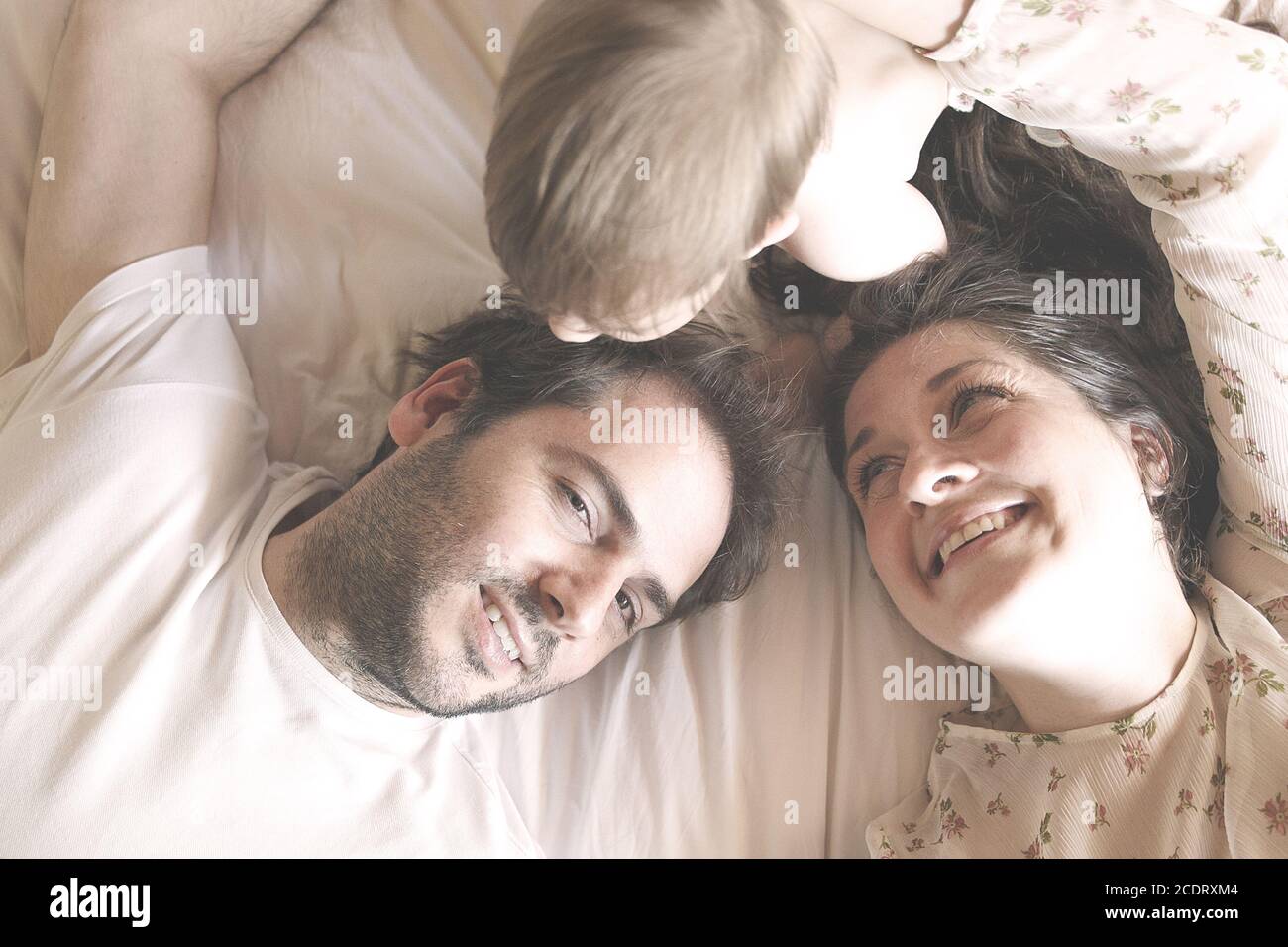 family in the privacy of the bedroom II Stock Photo