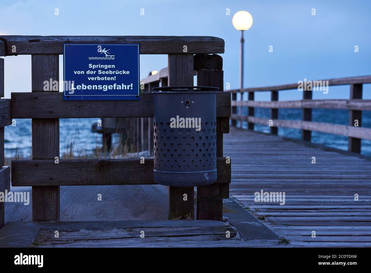 Promenade Pier with Danger Sign Stock Photo
