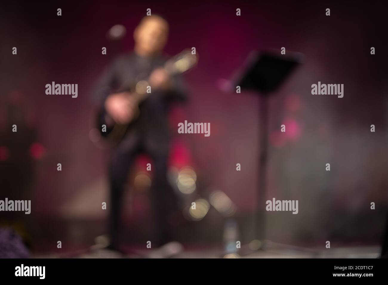 Blur defocus texture, background for design. Singers and musicians perform on stage. Stock Photo