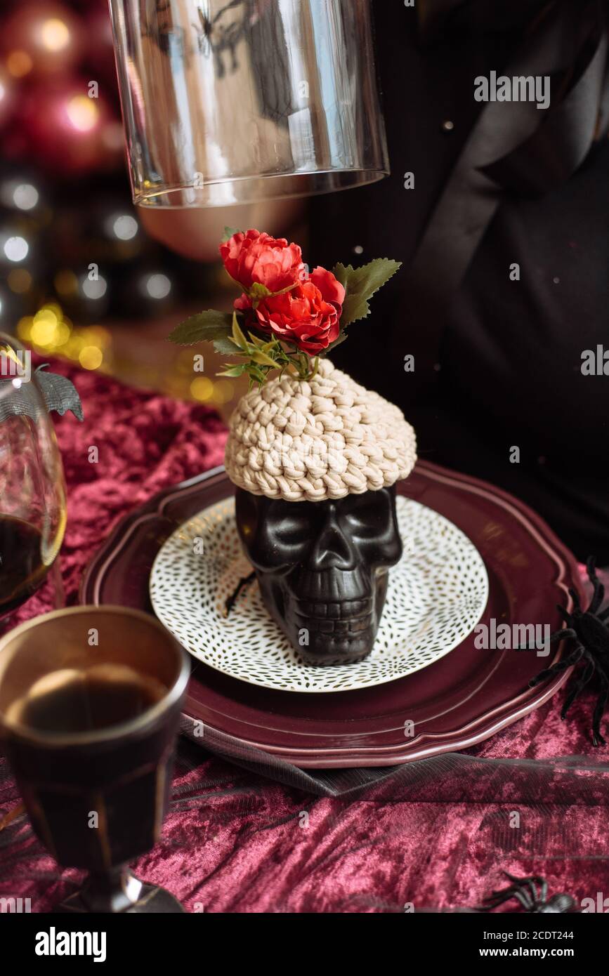 Artificial skull with knitted brains. Halloween decorations. Stock Photo