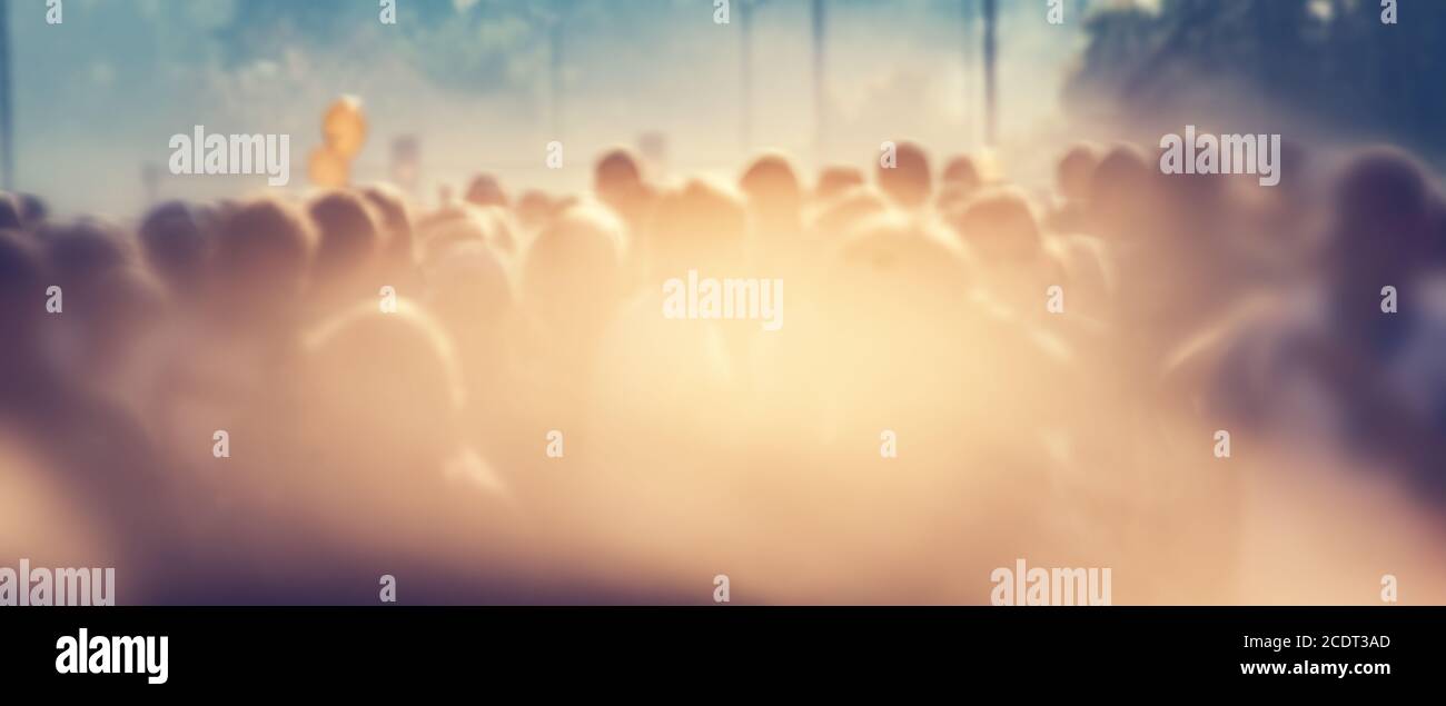 People crowd in the morning, sun flare. Blur background banner Stock Photo