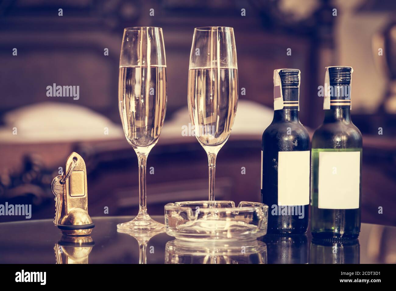 Champagne, glasses, antique keys. Luxury hotel apartment, room service Stock Photo