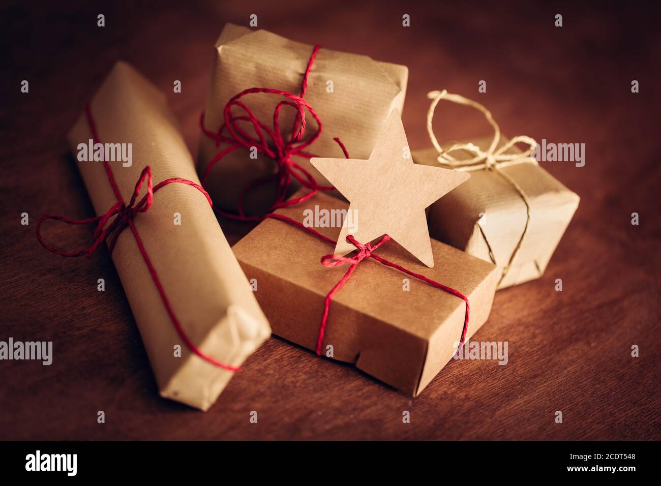 Rustic retro gift, present boxes with tag. Christmas time, eco paper wrap. Stock Photo
