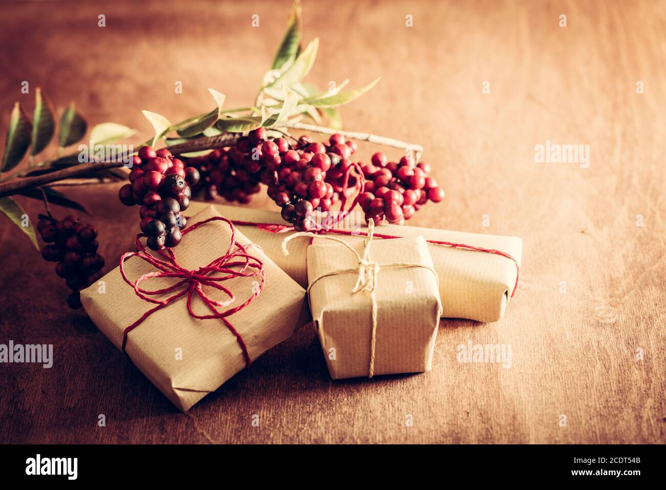 Rustic retro gift, present boxes with decorations. Christmas time, eco paper wrap. Stock Photo