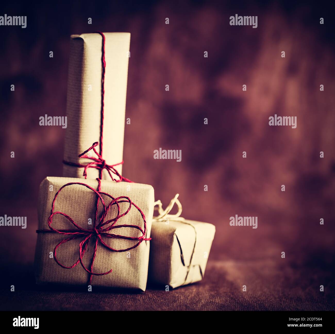 Rustic retro gifts, present boxes on wooden background. Christmas time Stock Photo