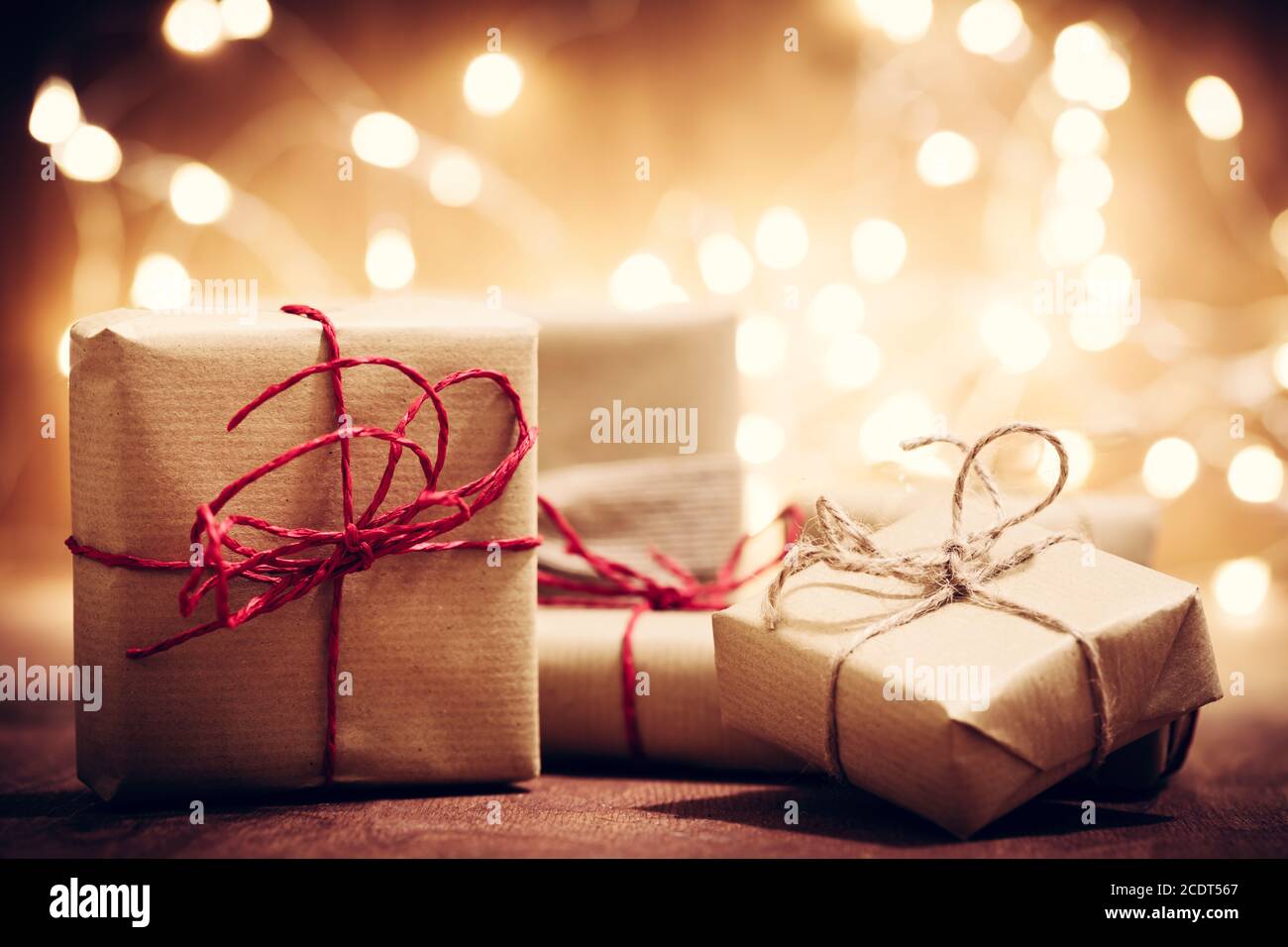Rustic retro gifts, present boxes on glitter background. Christmas time Stock Photo